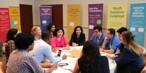 Experts and advocates discuss youth challenges at a conference.