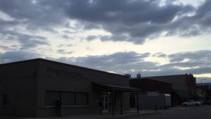 Northlands Rescue Mission building with concerned people outside